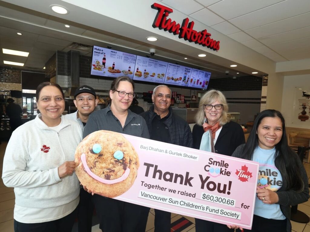 Members of the Tim Hortons Smile Cookie campaign, from left, Edel Bonao, Harpreet Shergill, Rachael Stankowski, Gurtek Shoker, Gillian Shaw (fund vice-chair) and Maridel Catacutan. Photo by NICK PROCAYLO /PNG