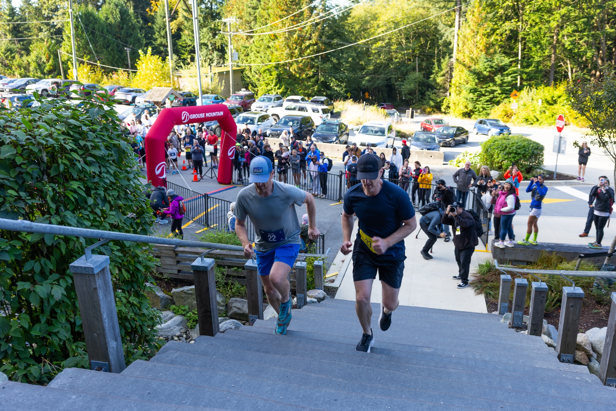 Daniel Sedin (left) and Henrik Sedin start their race up the Grouse Grind at the Sedin vs Sedin race at Grouse Mountain to support Adopt-A-School. Photo by Mark Yuen Visuals